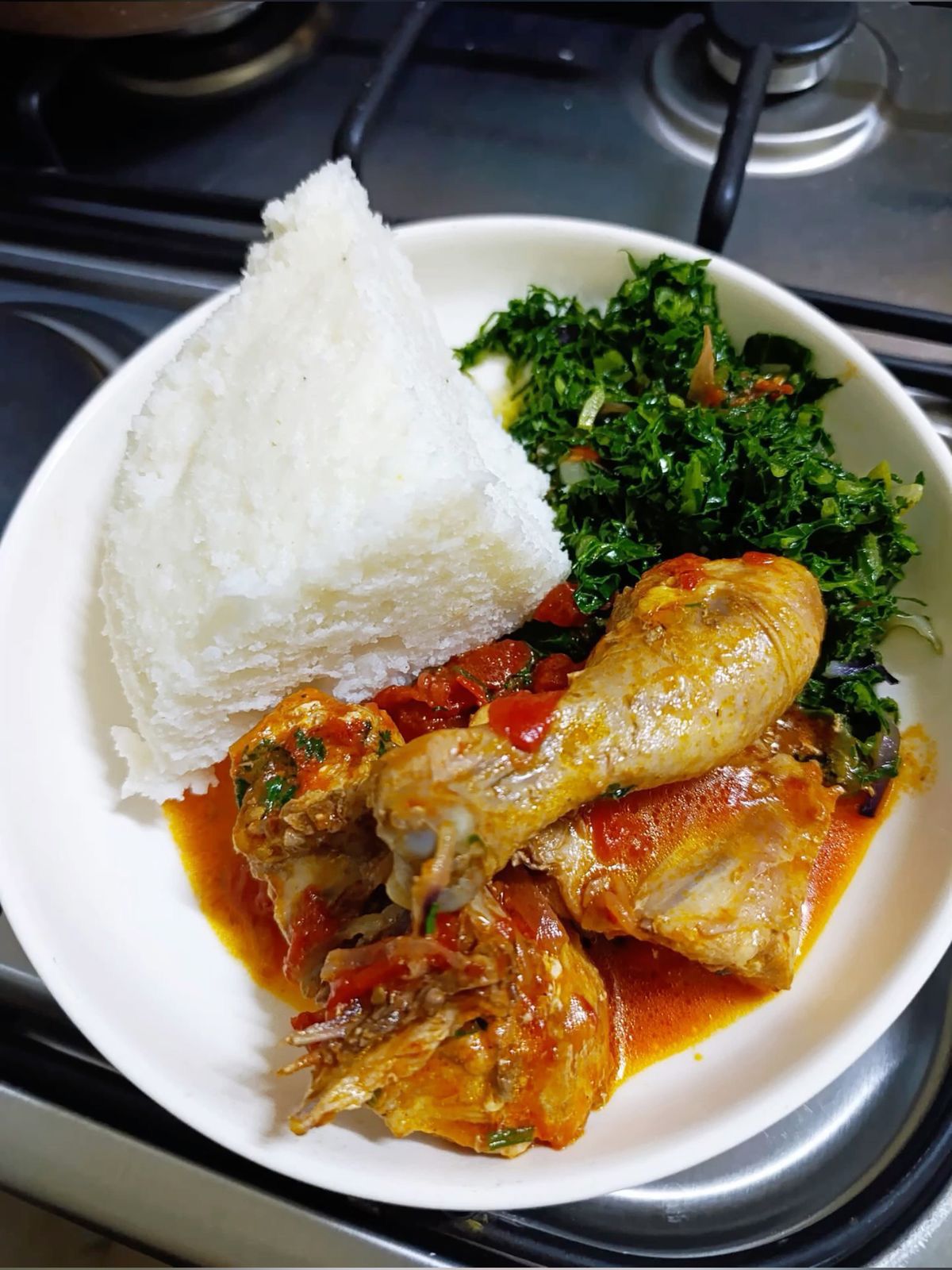 Traditional matoke (cooked plantains) with stew